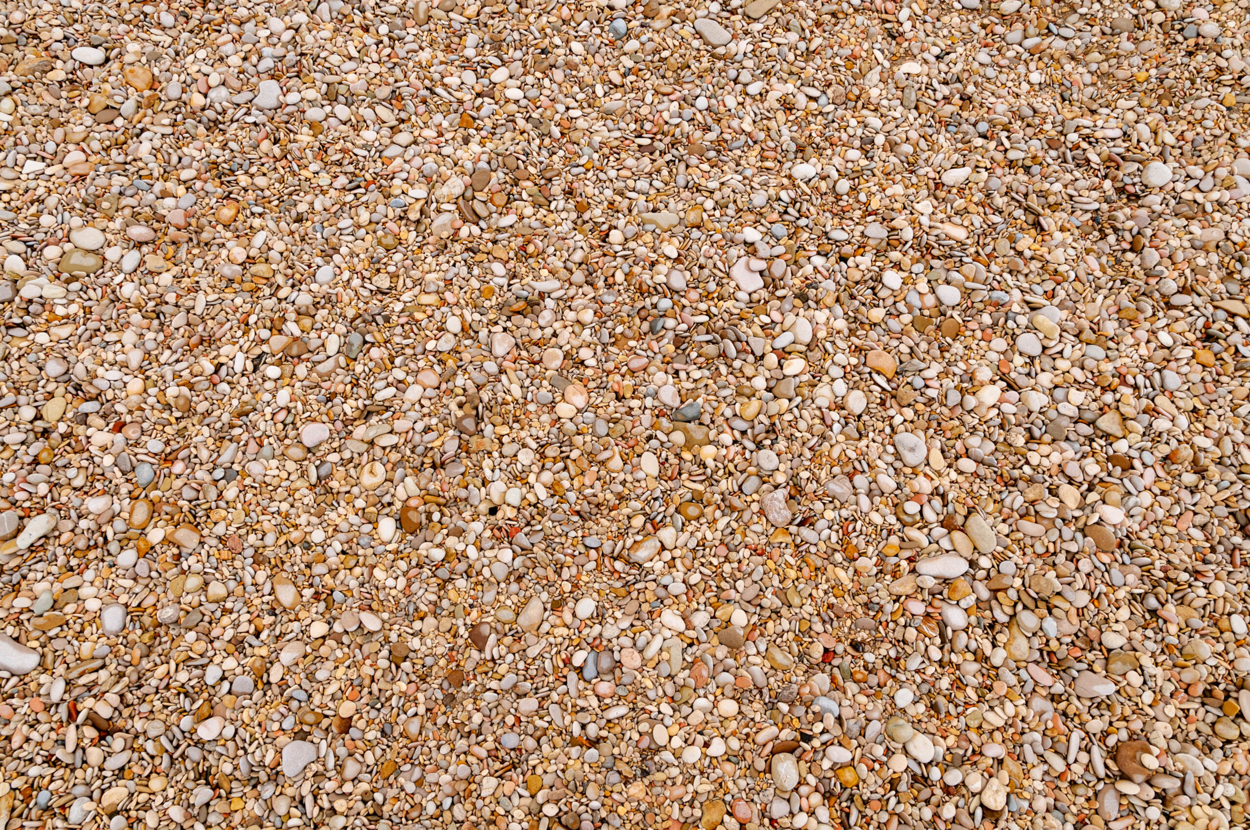 Small pebble stones beach sand free stockphoto